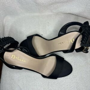 Nicole Miller Black Heels with Ankle Strap and Modern Silhouette